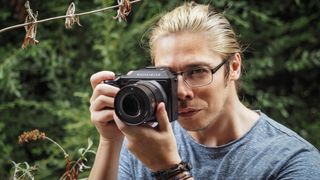 Camera expert James Artaius holding the Hasselblad X2D medium format camera